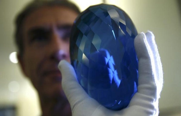 Philanthropist Maurice Ostro holds his Ostro Topaz Gemstone