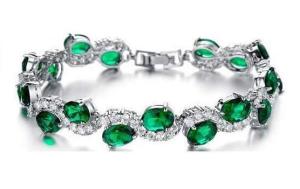 12.50Cts Oval Emerald Unique Curve Tennis Bracelet in 14k White Gold Plated